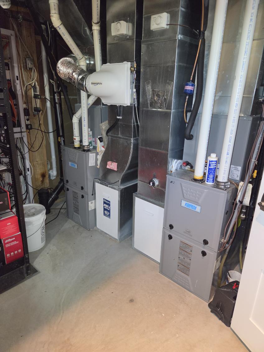 Two high-efficiency furnaces with a whole-home humidifier and a media air cleaner on the ductwork